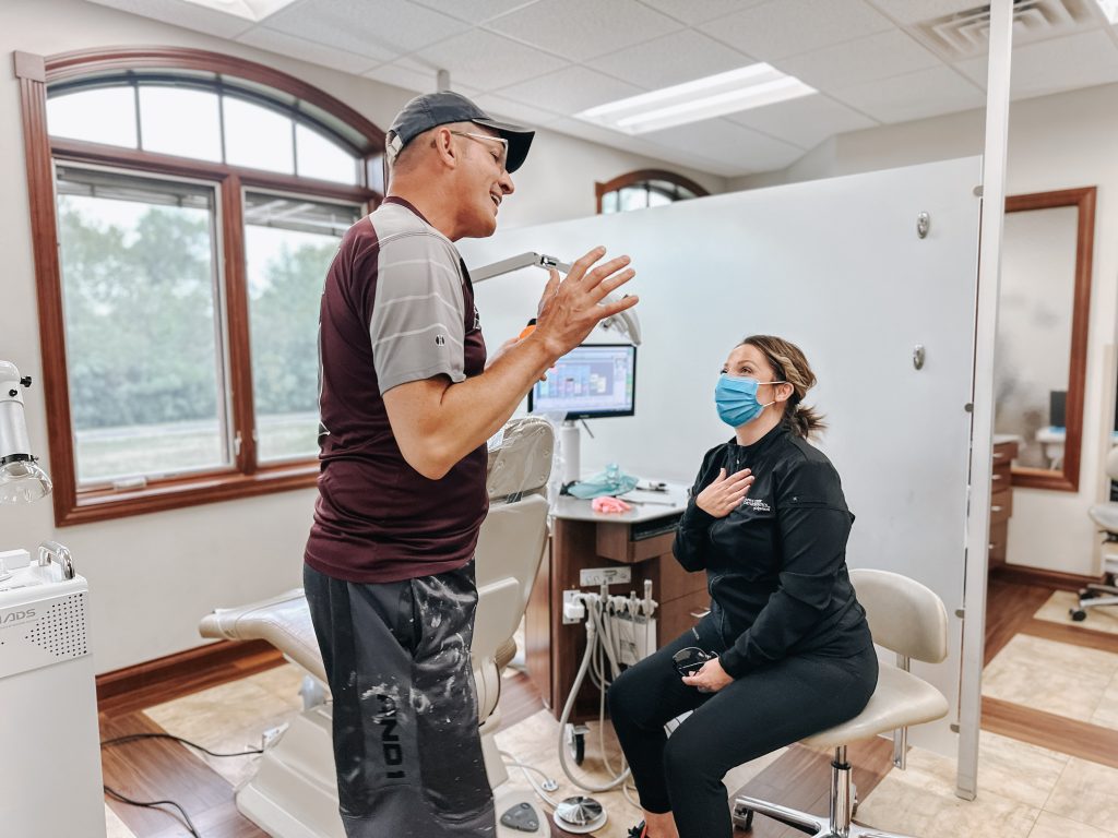 patient speaking and laughing with team member